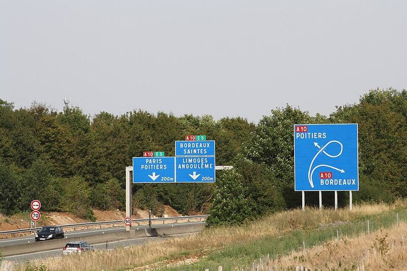Blue French motorway signs for Poitiers and Bordeaux beside the A10