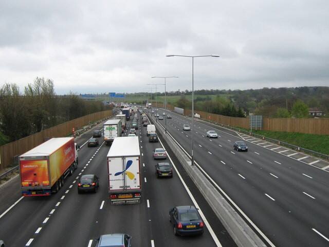 Queuing traffic and lorries on the M25 motorway