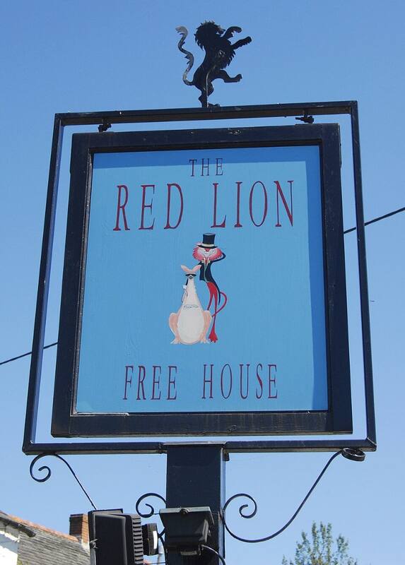 The Red Lion inn sign, with a carved lion standing on top